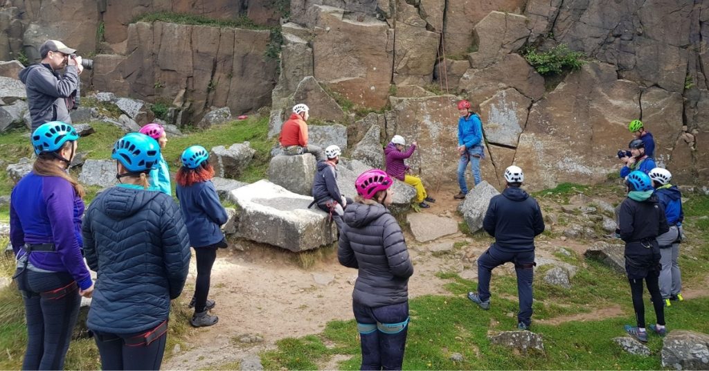 Group at the rockface under instruction from from Dan Mckinlay